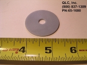 A rubber washer is shown next to a ruler.