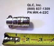 A metal object is shown next to a measuring tape.
